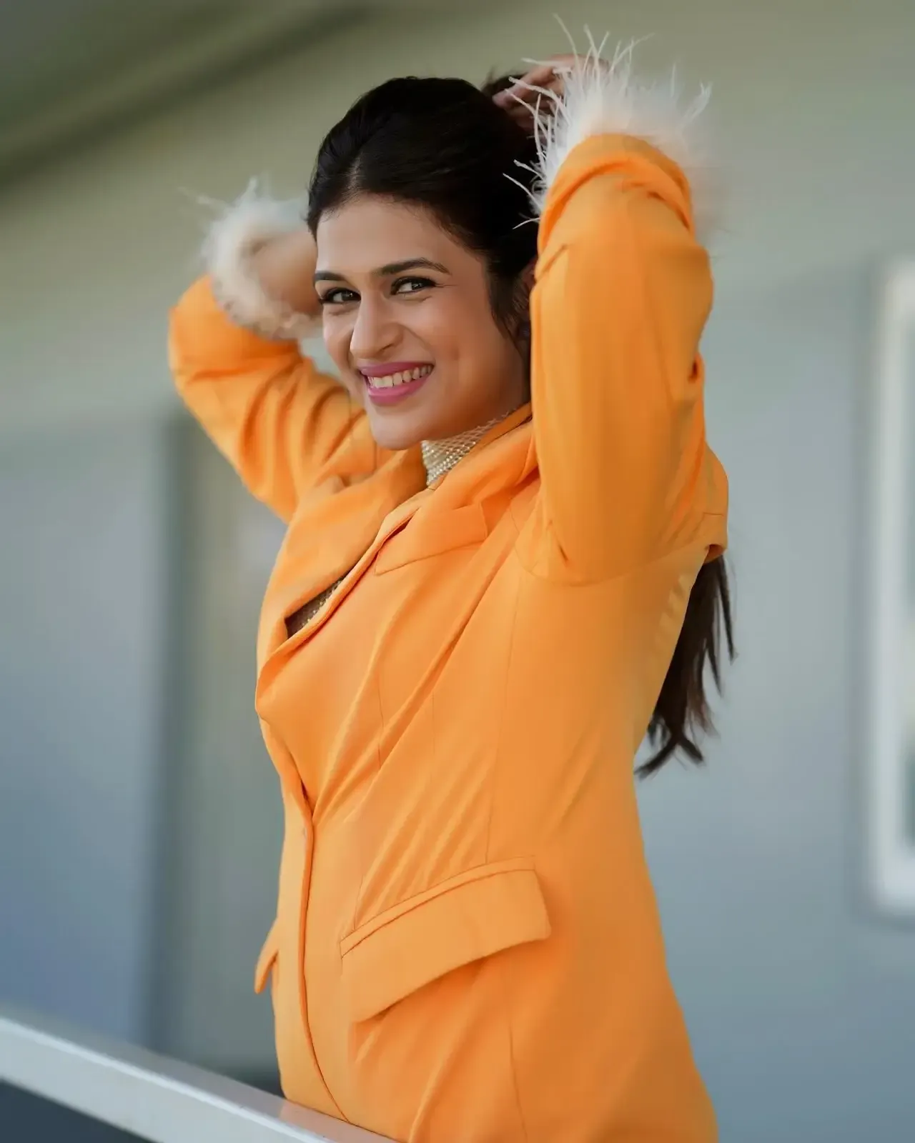 Actress Shraddha Das Long Legs Show in Mini Orange Top